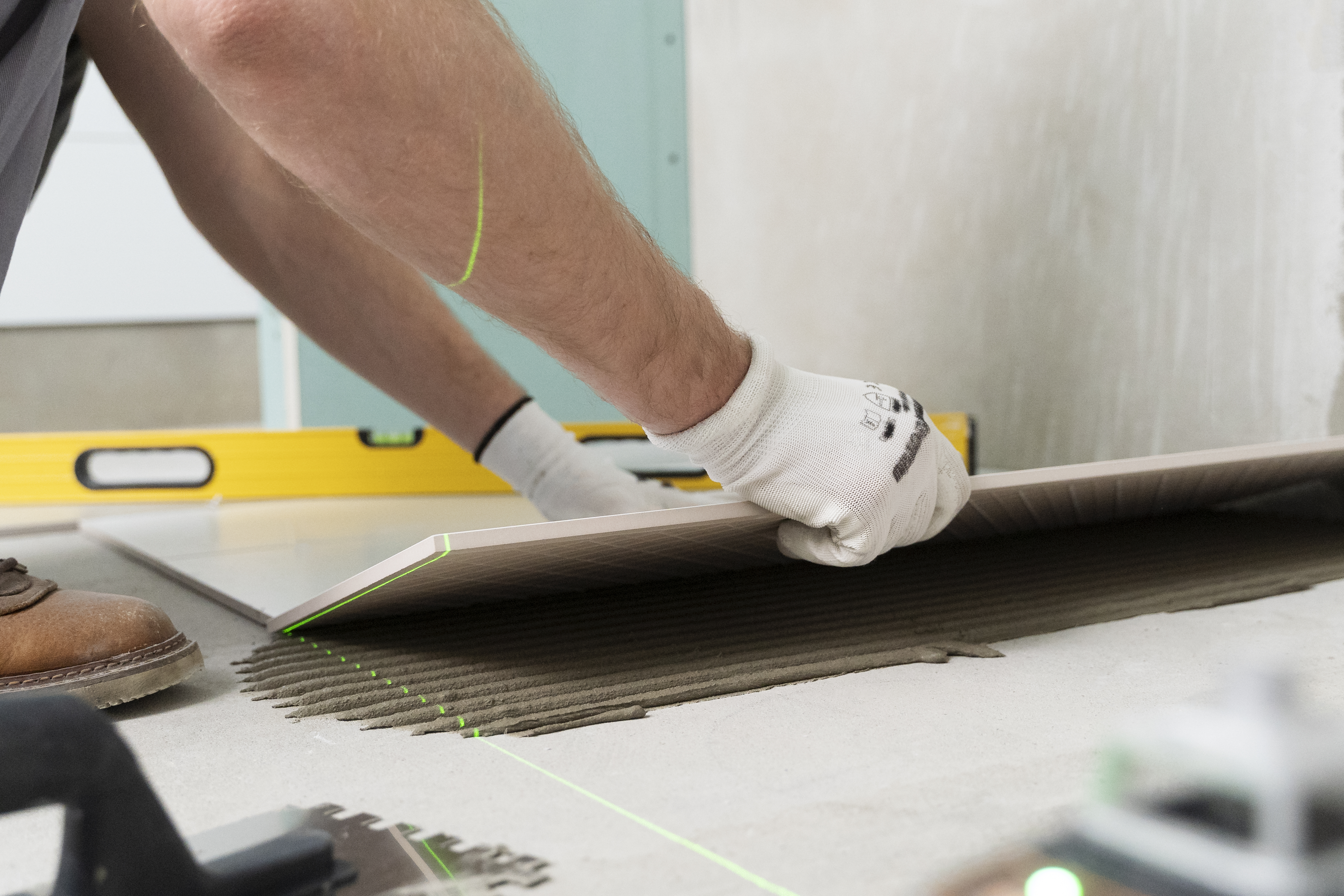 tiler working renovation apartment
